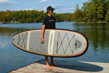 man carrying a Cruiser SUP® stand up paddle board - Bliss LE