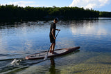 man stand up paddle boarding on Cruiser SUP® V-Max Woody 11'6 on a lake