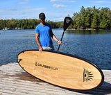 man carrying a Cruiser SUP® stand up paddle board - Blend LE