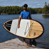 man carrying a Cruiser SUP® stand up paddle board - Escape LE
