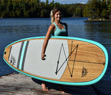 woman carrying a Cruiser SUP® stand up paddle board - Blend LE