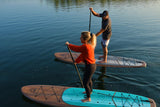 man and woman stand up paddle boarding on Cruiser SUP® Xplorer Classic on a lake