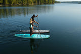 man and woman stand up paddle boarding on Cruiser SUP® Bliss LE on a lake