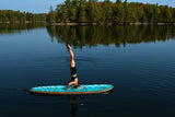 woman doing yoga on a Cruiser SUP® stand up paddle board - Xpedition Woody