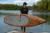 man carrying a Cruiser SUP® stand up paddle board - V-Max Woody 11'6
