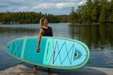 woman carrying a Cruiser SUP® stand up paddle board - Bliss LE