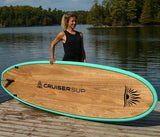 woman carrying a Cruiser SUP® stand up paddle board - Blend LE