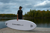 man carrying a Cruiser SUP® stand up paddle board - Xcursion Classic