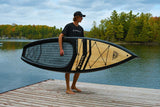 man carrying a Cruiser SUP® stand up paddle board - V-Max LE 12‘6