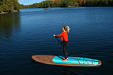 woman stand up paddle boarding on Cruiser SUP® Xplorer SE on a lake